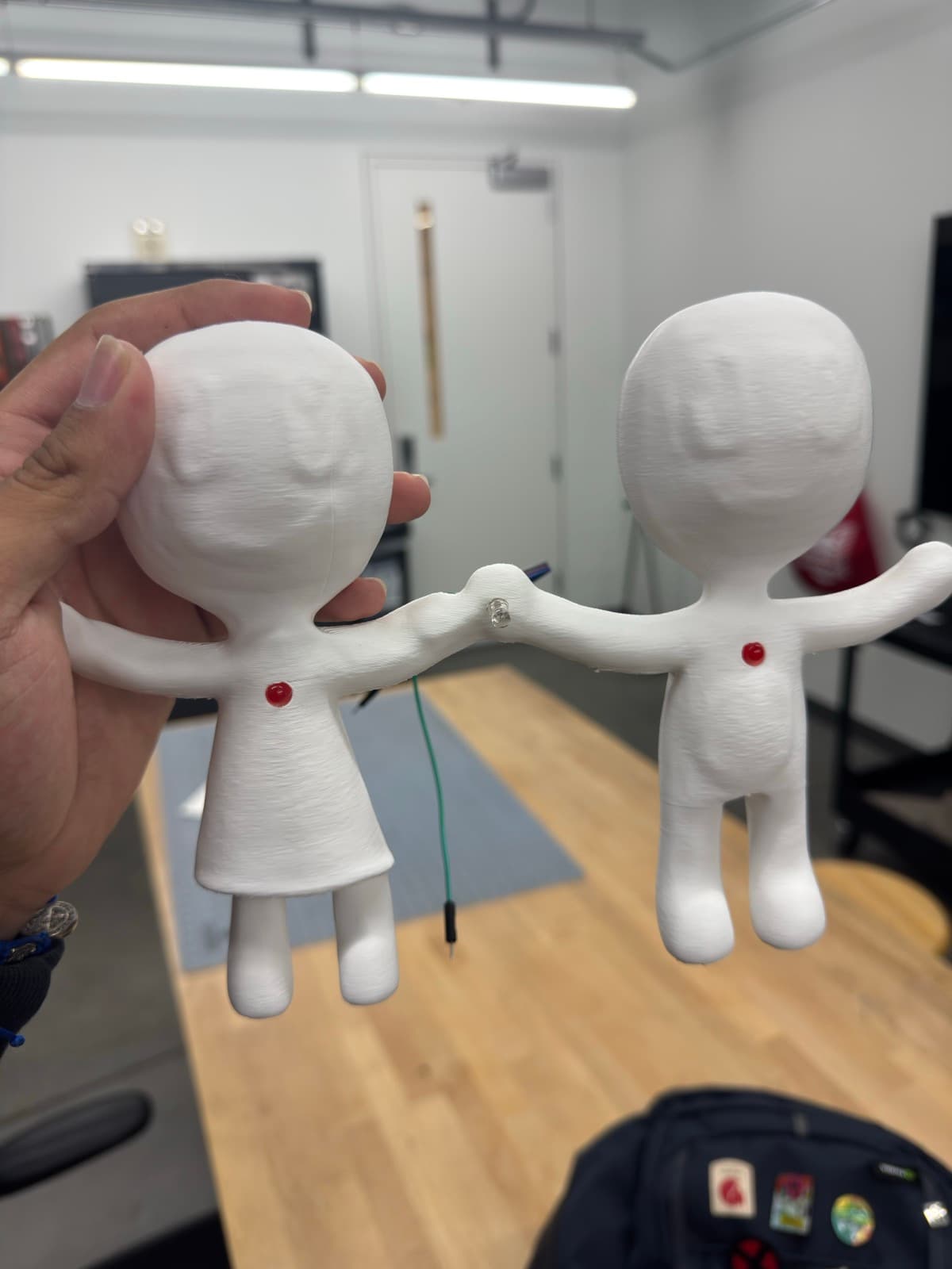 Quiet Connection 3D-printed figures and house display